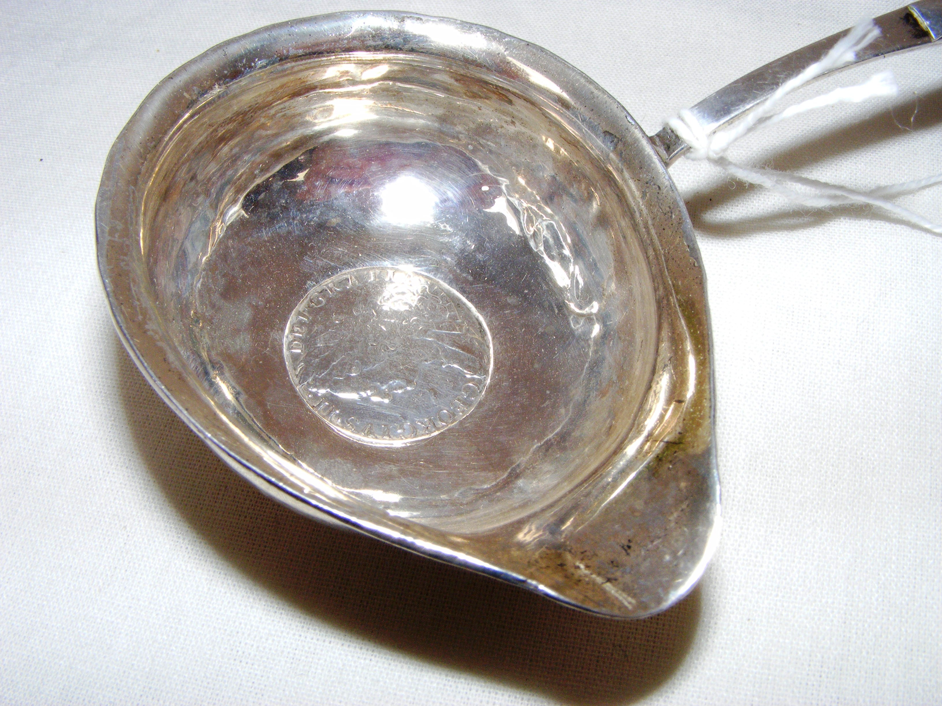 A mid 18th century George II silver punch ladle coin inset to the bowl with a wrythen bone handle, - Image 2 of 3