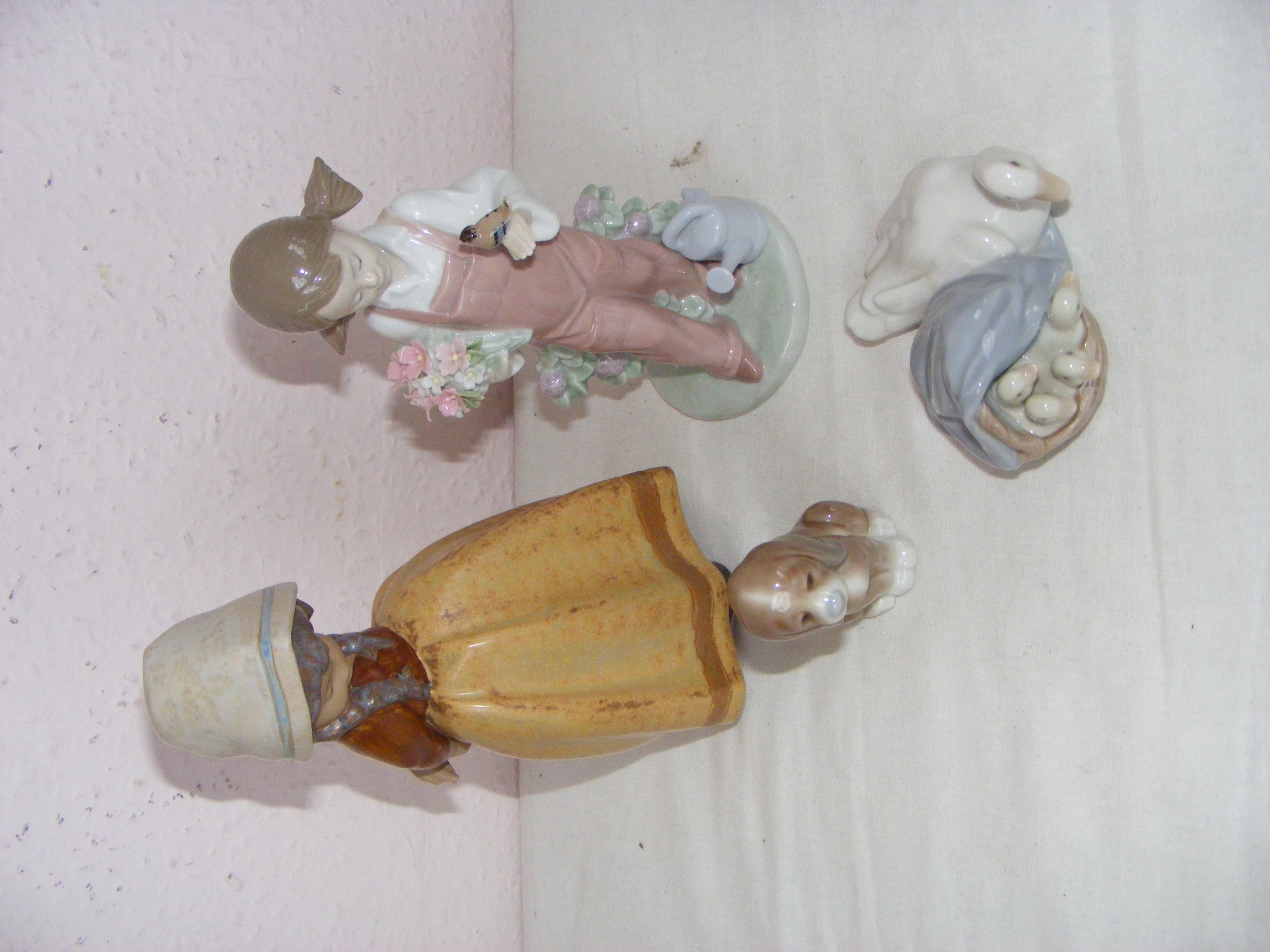 A Lladro figurine of a girl in a dress with head scarf 21. - Image 3 of 3