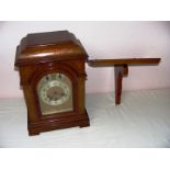 A Junghans B10 movement quarter Westminster chime mahogany cased bracket clock measuring 17" tall.