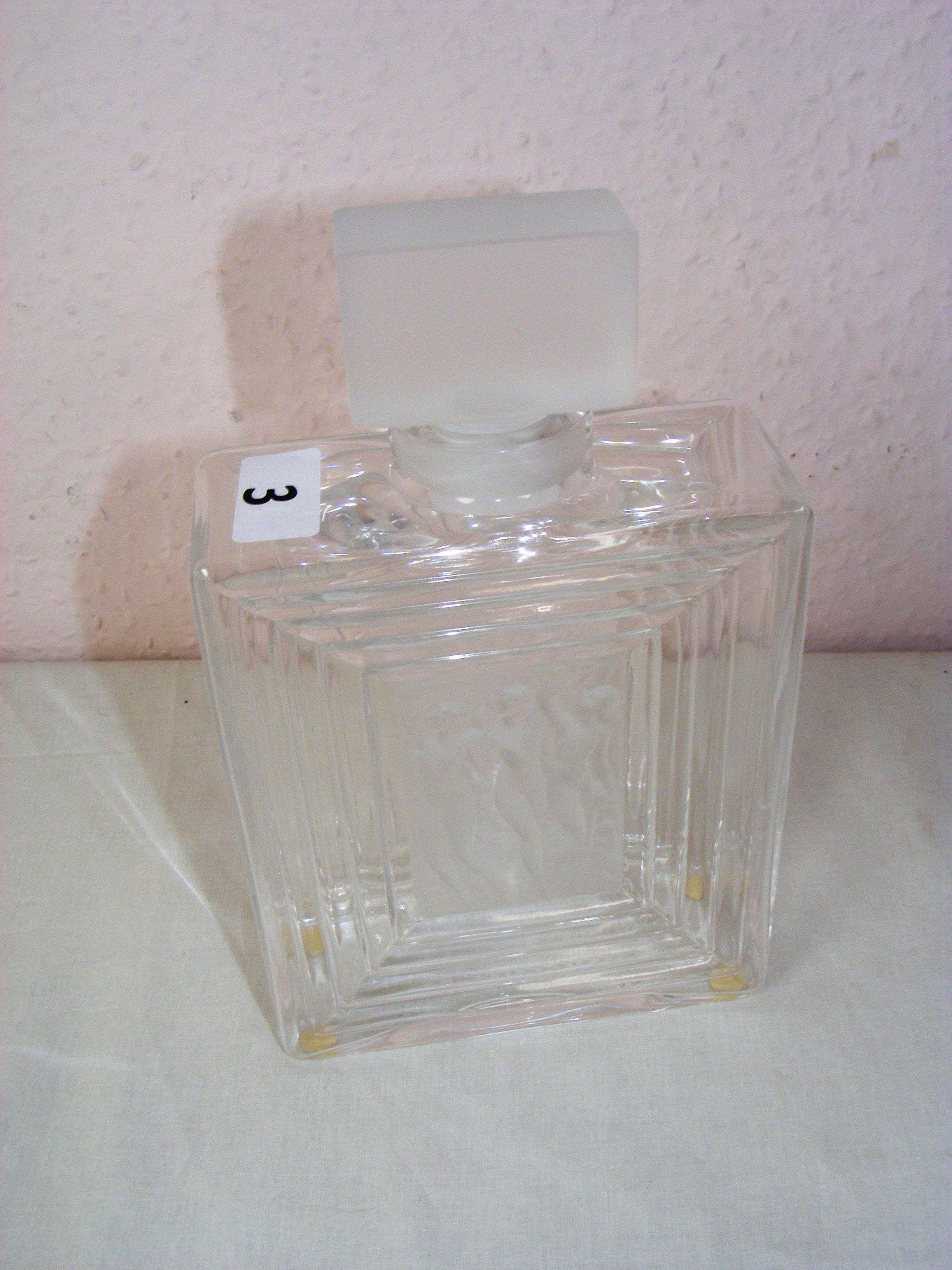 A Lalique Duncan #2 crystal perfume bottle, measuring 8" tall (with stopper). Signed to the base.