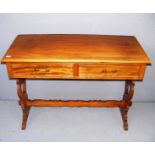 An early 20th century mahogany two drawer desk measuring 42" wide.