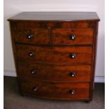 A Victorian mahogany bow fronted chest of drawers with pearl inlaid handles measuring 43" wide.