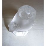 A Lalique frosted glass figurine of an owl, measuring 6cm tall, signed to the base.