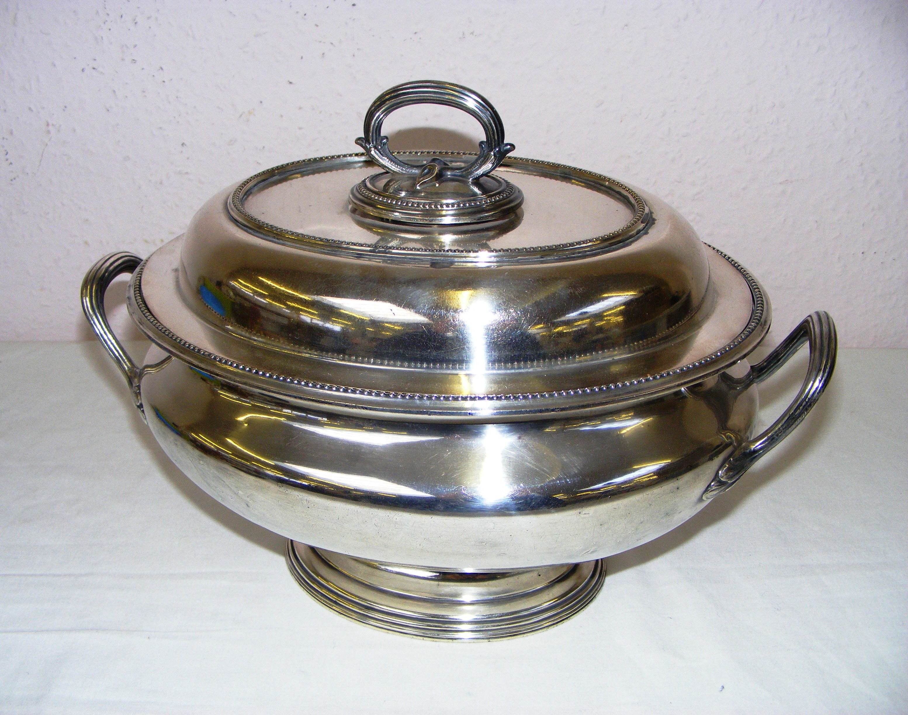 A large Elkington & Co 7486 soup tureen measuring 14" wide x 10.25" tall.