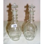 A pair of triple ring Georgian decanters with etched decoration and each standing at 9.