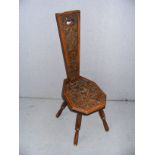 An early 20th century oak spinning chair dated 1931 measuring 37" tall.