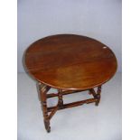 A drop leaf barley twist leg table measuring 33.5" wide.