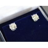 A Pair of 18ct. White Gold Screw Back Diamond Ear Studs, approximately 1.