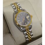 A Rolex Oyster Perpetual Date Adjust Superlative Chronometer Gold and Stainless Steel Ladies Wrist