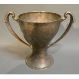 An Edwardian Silver Large Two Handled Trophy Cup of stylised form, Sheffield 1909,