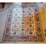 A North West Persian Style Woollen Rug with an all over design upon a cream and blue ground within