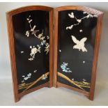 A 19th Century Japanese Lacquered Two Fold Screen inlaid with Mother of Pearl and Ivory depicting