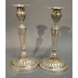 A Pair of Sheffield Silver Candlesticks in the Adams Style, 22.