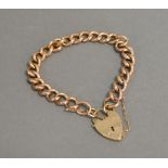 A 9ct. Gold Curb Link Bracelet with Padlock Clasp, 15.