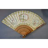 An Early Chinese Fan, hand painted with three cartouche and gold and green overall pattern,