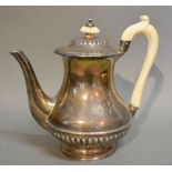 A George IV Silver Coffee Pot with Shaped Carved Handle and Finial, London 1825, maker's mark RG,