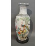 A 20th Century Chinese Porcelain Large Oviform Vase with hardwood stand,