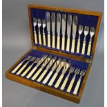 A Set of Twelve Sheffield Silver and Bone Handled Fish Knives and Forks within blue velvet lined