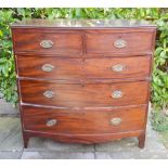 A 19th Century Mahogany Bow Fronted Chest of two short and three long drawers with oval brass