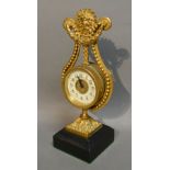 A French Gilded Mantle Clock in the form of a Lyre with central Sunburst,