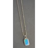 A Silver and Pear Shaped White Opalite Pendant with Chain
