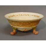 A Royal Worcester Blush Ivory Bowl decorated in relief with a continuous foliate band and raised