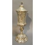 A Continental White Metal Covered Chalice with pineapple finial and shaped stepped base and