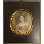 An Early 19th Century Portrait Miniature HALF LENGTH PORTRAIT OF A LADY IN PERIOD DRESS Within