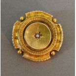 A Victorian Yellow Metal Brooch of Circular Form with central Pearl