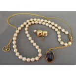 A Cultured Pearl Necklace with 9ct. Gold Clasp, together with a 9ct.