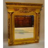 A French Gilt Framed Over Mantle Mirror with fluted half pilasters and relief moulded decoration,