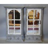 A Pair of Grey and Cream Painted Wall Mirrors in the form of Shutters,