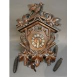 A Large Black Forest Cuckoo Clock with pierced bird surmount,