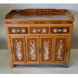 A 20th Century Chinese Hardwood Bone Inlaid Side Cabinet with a low galleried top above three