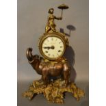 A French Patinated Bronze and Gilt Metal Mounted Mantle Clock,