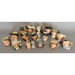 A Collection of Sixteen Miniature Royal Doulton Character Jugs to include Robinson Crusoe, Merlin,