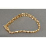 A 14ct. Gold Linked Bracelet, 11.