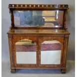 A William IV Rosewood Chiffonier with a Gothic pierced and mirrored back above two mirrored doors