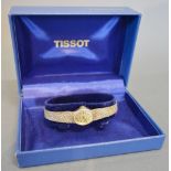 A Tissot 9ct. Gold Cased Ladies Wrist Watch together with a 9ct.