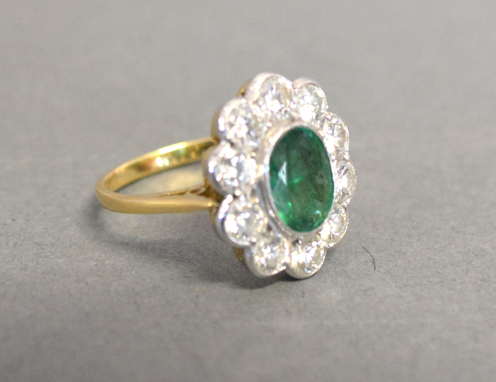 An 18ct. Yellow and White Gold Emerald a