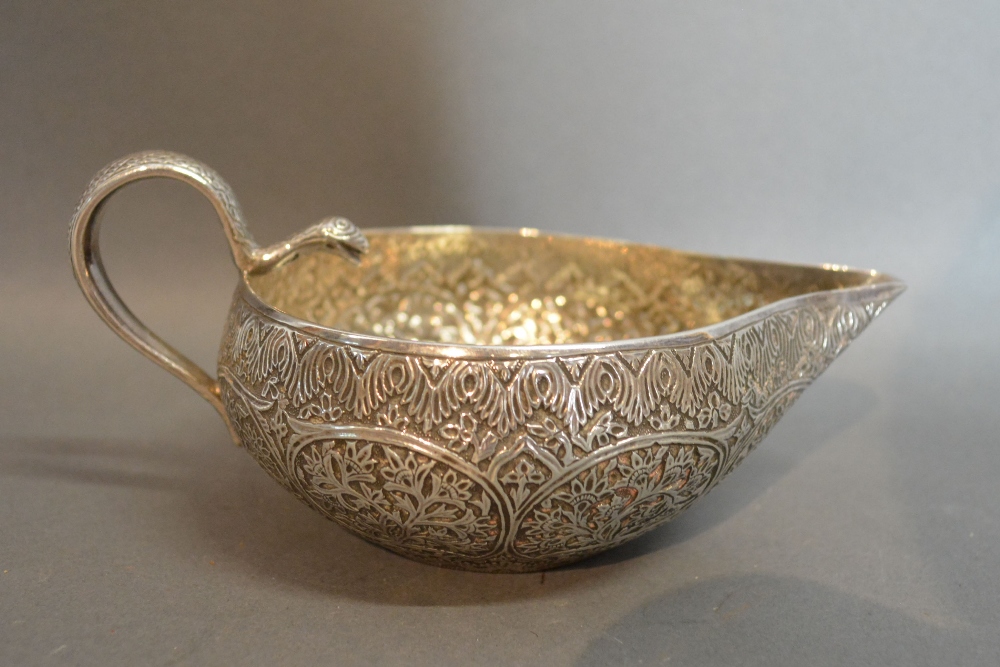 An Indian White Metal Jug with Shaped Ha