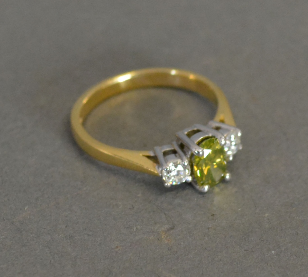 An 18ct. Yellow Gold Three Stone Ring, t