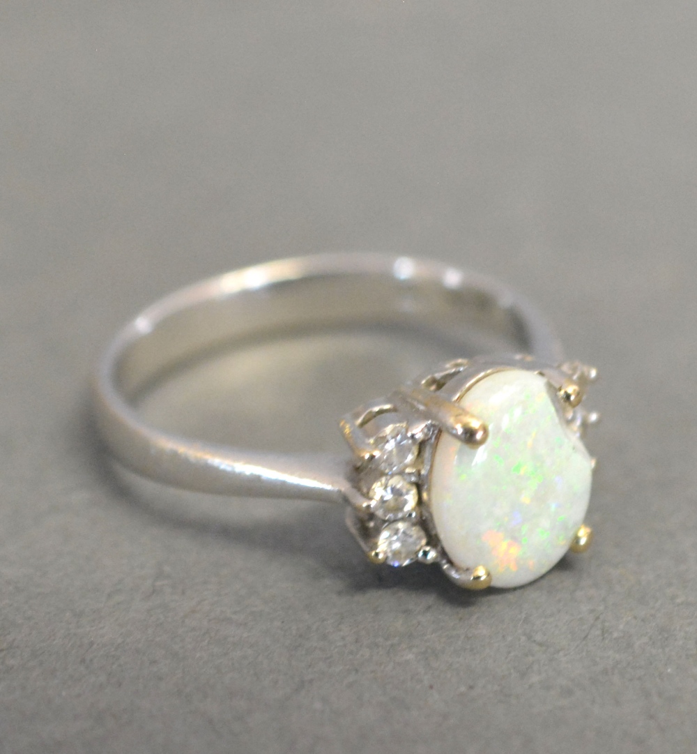 A Platinum Opal and Diamond Ring with an