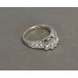 A 14ct. White Gold Three Stone Diamond R