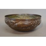 An Arts and Crafts Newlyn Copper Bowl decorated in relief with a band of carp, impressed mark, 26