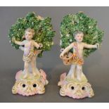 A Pair of Chelsea Porcelain Bocage Figures decorated in polychrome enamels and highlighted with gilt