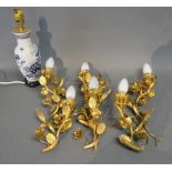 A Set of Three French Gilded Two Branch Wall Lights together with a table lamp