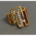 An 18ct. Gold Dress Ring set with a single band of diamonds, 9.9 gms