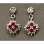 A Pair of 18ct. White Gold Ruby and Diamond Cluster Drop Ear Studs