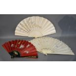 Two Ivory and Silkwork Fans, together with another ebonised fan with gilt decoration and rouge silk,